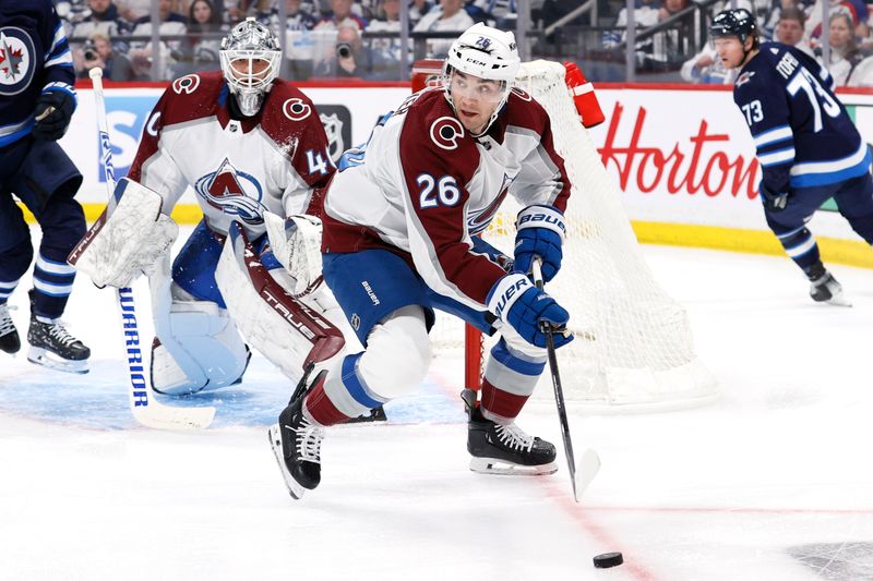 Apr 21, 2024; Winnipeg, Manitoba, CAN; Colorado Avalanche defenseman Sean Walker (26) clears the puck from in front of Colorado Avalanche goaltender Alexandar Georgiev (40) in the second period against the Winnipeg Jets in game one of the first round of the 2024 Stanley Cup Playoffs at Canada Life Centre. Mandatory Credit: James Carey Lauder-USA TODAY Sports