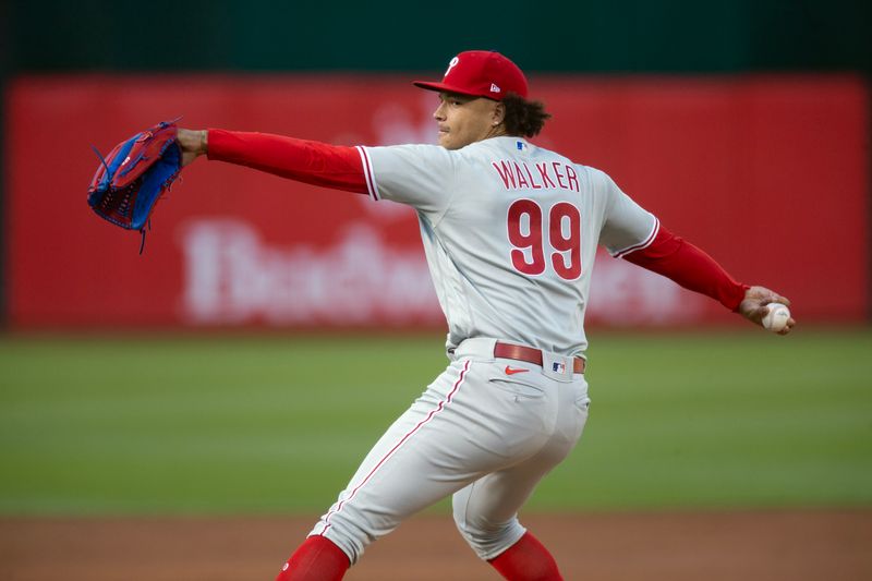 Jun 16, 2023; Oakland, California, USA; Philadelphia Phillies starting pitcher Taijuan Walker (99) pitches against the Oakland Athletics during the second inning at Oakland-Alameda County Coliseum. Mandatory Credit: D. Ross Cameron-USA TODAY Sports