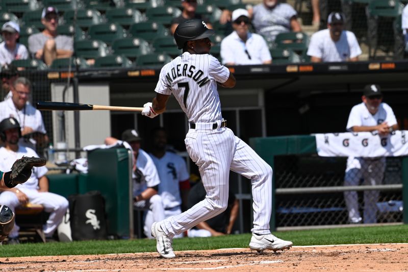 Aug 23, 2023; Chicago, Illinois, USA;  Chicago White Sox shortstop Tim Anderson (7) hits an RBI single against the Seattle Mariners during the third inning at Guaranteed Rate Field. Mandatory Credit: Matt Marton-USA TODAY Sports