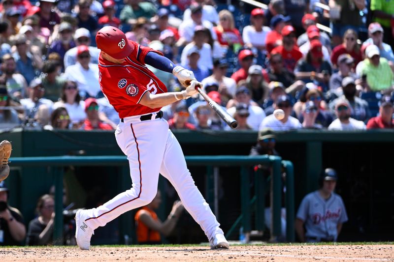 May 21, 2023; Washington, District of Columbia, USA; Washington Nationals catcher Riley Adams (15) doubles against the Detroit Tigers during the fifth inning at Nationals Park. Mandatory Credit: Brad Mills-USA TODAY Sports