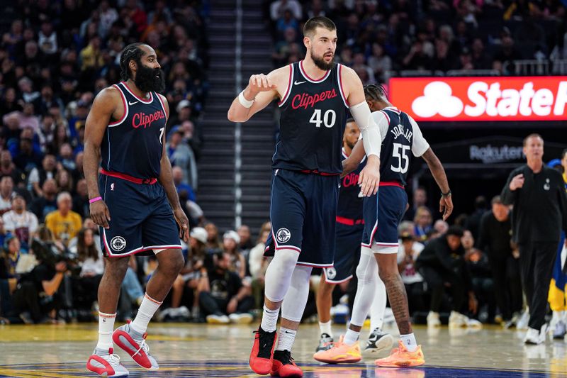 SAN FRANCISCO, CA - OCTOBER 27: James Harden #1 and Ivica Zubac #40 of the Los Angeles Clippers celebrate a basket in the fourth quarter against the Golden State Warriors at Chase Center on October 27, 2024 in San Francisco, California. NOTE TO USER: User expressly acknowledges and agrees that, by downloading and or using this photograph, User is consenting to the terms and conditions of the Getty Images License Agreement. (Photo by Kavin Mistry/Getty Images)