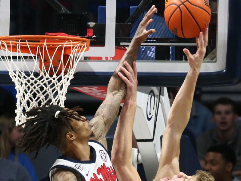 Jan 10, 2024; Oxford, Mississippi, USA; Mississippi Rebels guard Allen Flanigan (7) blocks the shot of Florida Gators forward/center Alex Condon (21) during the second half at The Sandy and John Black Pavilion at Ole Miss. Mandatory Credit: Petre Thomas-USA TODAY Sports