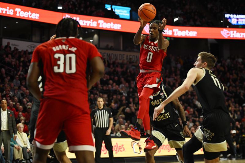 Jan 28, 2023; Winston-Salem, North Carolina, USA;  North Carolina State Wolfpack guard Terquavion Smith (0) shoots a runner between Wake Forest Demon Deacons guard Damari Monsanto (30) and forward Andrew Carr (11) during the second half at Lawrence Joel Veterans Memorial Coliseum. Mandatory Credit: William Howard-USA TODAY Sports