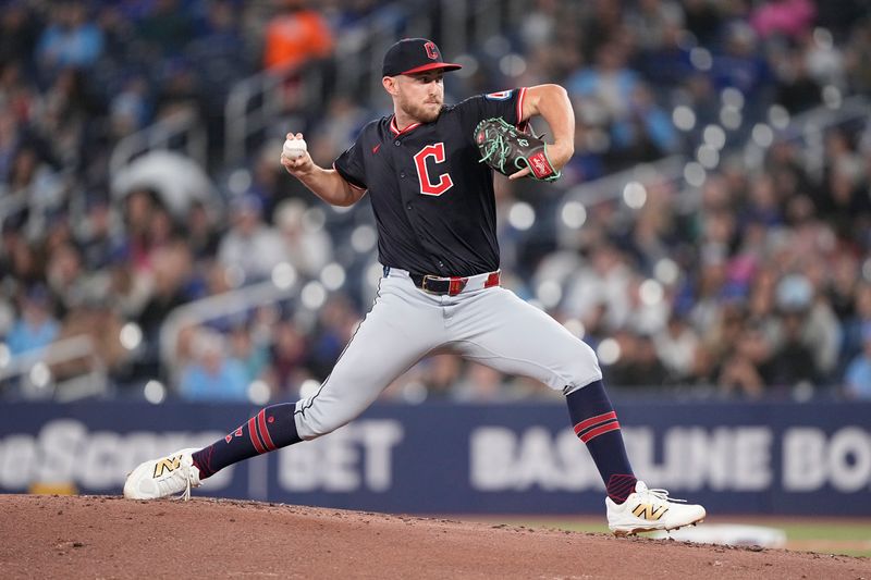 May 4, 2025; Toronto, Ontario, CAN; Cleveland Guardians starting pitcher Tanner Bibee (28) pitches to the Toronto Blue Jays during the first inning at Rogers Centre. Mandatory Credit: John E. Sokolowski-Imagn Images