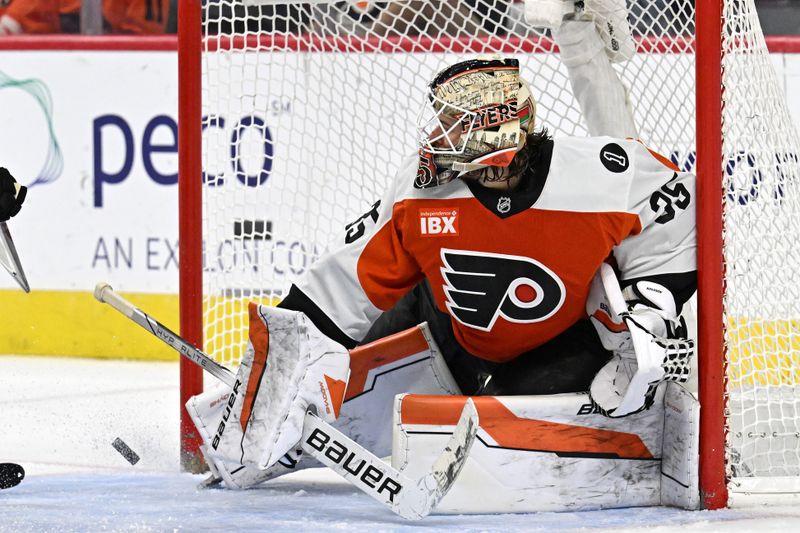 Nov 2, 2025; Philadelphia, Pennsylvania, USA; Philadelphia Flyers goaltender Aleksei Kolosov (35) makes a save against the Calgary Flames during the first period at Xfinity Mobile Arena. Mandatory Credit: Eric Hartline-Imagn Images