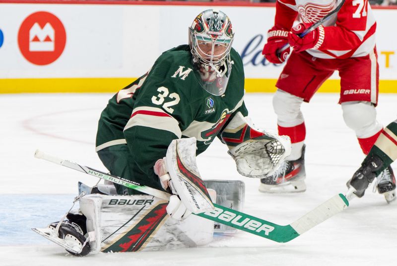 Feb 25, 2025; Saint Paul, Minnesota, USA; Minnesota Wild goaltender Filip Gustavsson (32) watches a rebound against the Detroit Red Wings in the third period at Xcel Energy Center. Mandatory Credit: Matt Blewett-Imagn Images