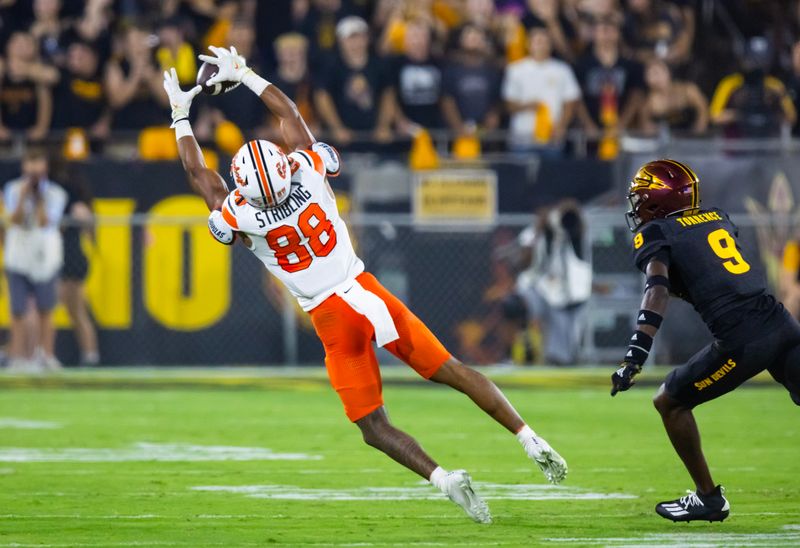 Sep 9, 2023; Tempe, Arizona, USA; Oklahoma State Cowboys wide receiver De'Zhaun Stribling (88) catches a pass against the Arizona State Sun Devils in the first half at Mountain America Stadium. Mandatory Credit: Mark J. Rebilas-USA TODAY Sports