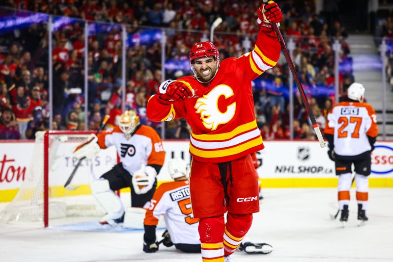 Oct 12, 2024; Calgary, Alberta, CAN; Calgary Flames center Nazem Kadri (91) celebrates his goal against the Philadelphia Flyers during the second period at Scotiabank Saddledome. Mandatory Credit: Sergei Belski-Imagn Images