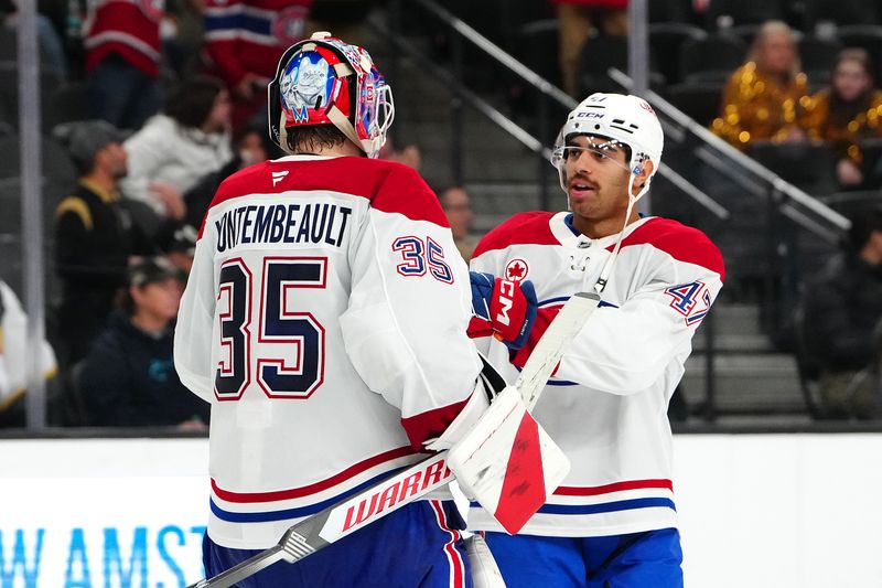 Nov 28, 2025; Las Vegas, Nevada, USA; Montréal Canadiens defenseman Jayden Struble (47) congratulates goaltender Sam Montembeault (35) after the Canadiens defeated the Vegas Golden Knights 4-1 at T-Mobile Arena. Mandatory Credit: Stephen R. Sylvanie-Imagn Images