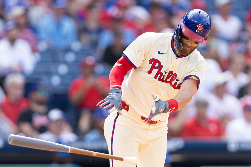 May 8, 2024; Philadelphia, Pennsylvania, USA; Philadelphia Phillies first base Bryce Harper (3) reacts to grounding out to end the eighth inning against the Toronto Blue Jays at Citizens Bank Park. Mandatory Credit: Bill Streicher-USA TODAY Sports