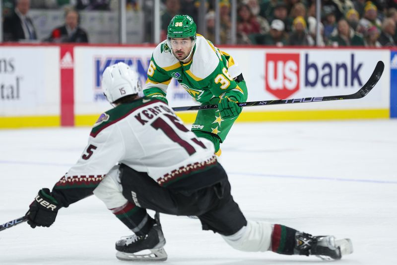 Jan 13, 2024; Saint Paul, Minnesota, USA; Minnesota Wild right wing Mats Zuccarello (36) passes as Arizona Coyotes center Alexander Kerfoot (15) during the second period at Xcel Energy Center. Mandatory Credit: Matt Krohn-USA TODAY Sports