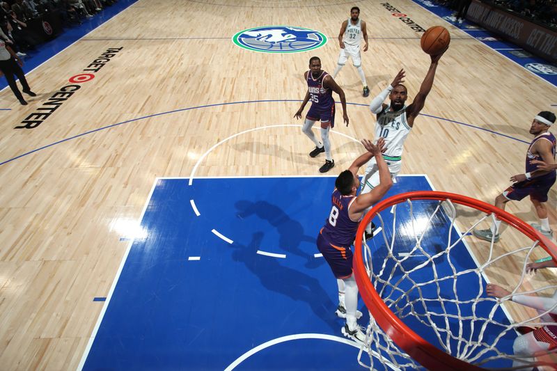 MINNEAPOLIS, MN -  APRIL 20: Mike Conley #10 of the Minnesota Timberwolves shoots the ball during Round One Game One of the 2024 NBA Playoffs against the Phoenix Suns on April 20, 2024 at Target Center in Minneapolis, Minnesota. NOTE TO USER: User expressly acknowledges and agrees that, by downloading and or using this Photograph, user is consenting to the terms and conditions of the Getty Images License Agreement. Mandatory Copyright Notice: Copyright 2024 NBAE (Photo by Jordan Johnson/NBAE via Getty Images)