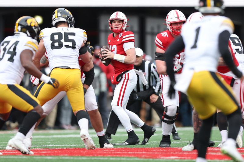 Nov 24, 2023; Lincoln, Nebraska, USA; Nebraska Cornhuskers quarterback Chubba Purdy (12) throws the football against the Iowa Hawkeyes at Memorial Stadium. Mandatory Credit: Reese Strickland-USA TODAY Sports