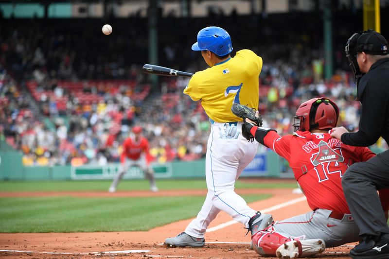 Apr 13, 2024; Boston, Massachusetts, USA;  Boston Red Sox designated hitter Masataka Yoshida (7) hits an RBI single during the first inning against the Los Angeles Angels at Fenway Park. Mandatory Credit: Bob DeChiara-USA TODAY Sports