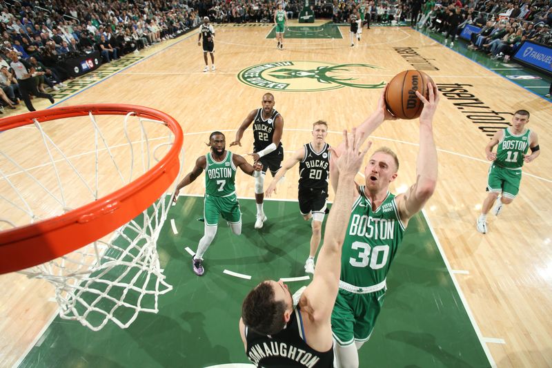 MILWAUKEE, WI - APRIL 9: Sam Hauser #30 of the Boston Celtics drives to the basket during the game against the Milwaukee Bucks on April 9, 2024 at the Fiserv Forum Center in Milwaukee, Wisconsin. NOTE TO USER: User expressly acknowledges and agrees that, by downloading and or using this Photograph, user is consenting to the terms and conditions of the Getty Images License Agreement. Mandatory Copyright Notice: Copyright 2024 NBAE (Photo by Gary Dineen/NBAE via Getty Images).