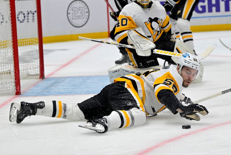 Feb 11, 2023; Los Angeles, California, USA;  Pittsburgh Penguins defenseman Chad Ruhwedel (2) makes a shop on the puck with his hand in the second period against the Los Angeles Kings at Crypto.com Arena. Mandatory Credit: Jayne Kamin-Oncea-USA TODAY Sports