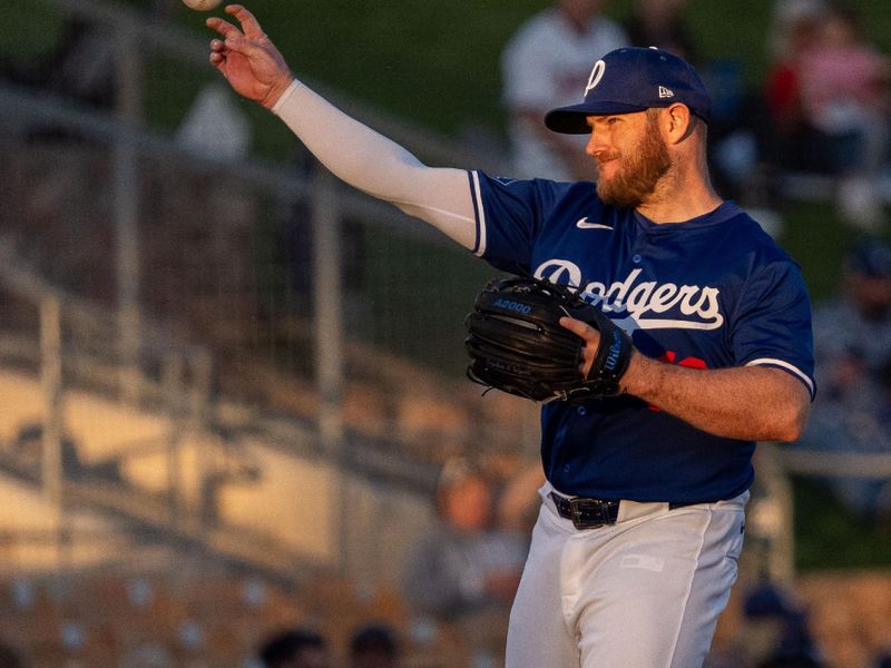 Mar 5, 2024; Phoenix, Arizona, USA;  Los Angeles Dodgers infielder Max Muncy (13) throws to home in the first during a spring training game against the Los Angeles Angels at Camelback Ranch-Glendale. Mandatory Credit: Allan Henry-USA TODAY Sports