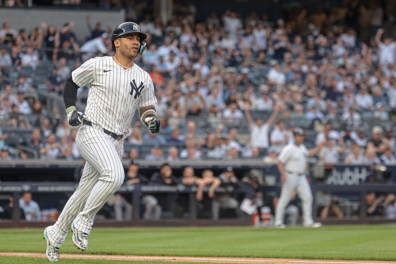 Jun 5, 2024; Bronx, New York, USA; New York Yankees second baseman Gleyber Torres (25) hits a two RBI ground rule double during the first inning against the Minnesota Twins at Yankee Stadium. Mandatory Credit: Vincent Carchietta-USA TODAY Sports