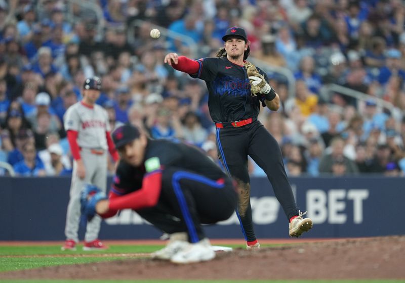 Jun 19, 2024; Toronto, Ontario, CAN; Toronto Blue Jays third baseman Addison Barger (47) throws to first base for the out against the Boston Red Sox during fifth inning at Rogers Centre. Mandatory Credit: Nick Turchiaro-USA TODAY Sports