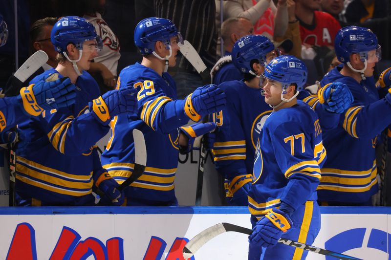 Nov 5, 2024; Buffalo, New York, USA;  Buffalo Sabres right wing JJ Peterka (77) celebrates his goal with teammates during the third period against the Ottawa Senators at KeyBank Center. Mandatory Credit: Timothy T. Ludwig-Imagn Images