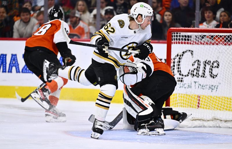 Jan 27, 2024; Philadelphia, Pennsylvania, USA; Boston Bruins center Oskar Steen (62) collides with Philadelphia Flyers goalie Samuel Ersson (33) in the first period at Wells Fargo Center. Mandatory Credit: Kyle Ross-USA TODAY Sports