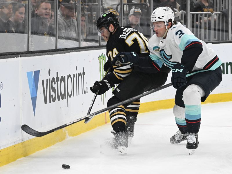 Feb 15, 2024; Boston, Massachusetts, USA; Boston Bruins left-wing Jake DeBrusk (74) controls the puck against Seattle Kraken defenseman Will Borgen (3) during the third period at the TD Garden. Mandatory Credit: Brian Fluharty-USA TODAY Sports