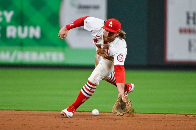 Aug 26, 2024; St. Louis, Missouri, USA;  St. Louis Cardinals second baseman Brendan Donovan (33) fields a ground ball against the San Diego Padres during the eighth inning at Busch Stadium. Mandatory Credit: Jeff Curry-USA TODAY Sports