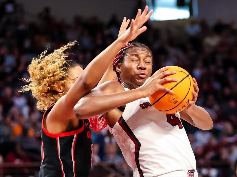 Feb 26, 2023; Columbia, South Carolina, USA; South Carolina Gamecocks forward Aliyah Boston (4) attempts to get around Georgia Lady Bulldogs forward Javyn Nicholson (35) in the first half at Colonial Life Arena. Mandatory Credit: Jeff Blake-USA TODAY Sports