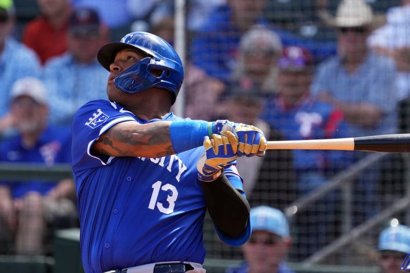 Mar 8, 2024; Surprise, Arizona, USA; Kansas City Royals catcher Salvador Perez (13) bats against the Texas Rangers during the second inning at Surprise Stadium. Mandatory Credit: Joe Camporeale-USA TODAY Sports