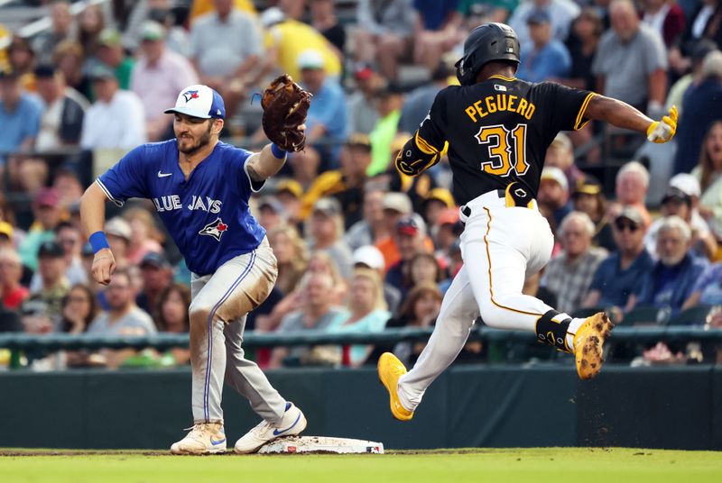 Mar 21, 2024; Bradenton, Florida, USA; Toronto Blue Jays first baseman Spencer Horwitz (48) forces out Pittsburgh Pirates shortstop Liover Peguero (31) during the fifth inning at LECOM Park. Mandatory Credit: Kim Klement Neitzel-USA TODAY Sports