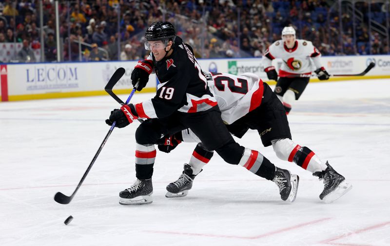 Jan 11, 2024; Buffalo, New York, USA;  Buffalo Sabres center Peyton Krebs (19) takes a shot on goal as Ottawa Senators left wing Parker Kelly (27) defends during the third period at KeyBank Center. Mandatory Credit: Timothy T. Ludwig-USA TODAY Sports