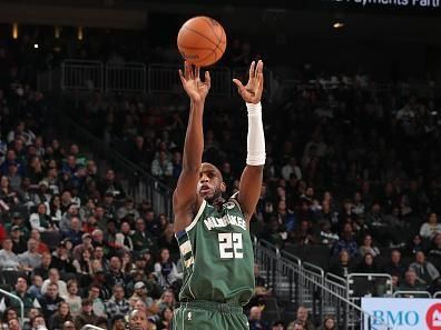 MILWAUKEE, WI - DECEMBER 21:  Khris Middleton #22 of the Milwaukee Bucks shoots the ball during the game against the Orlando Magic on December 21, 2023 at the Fiserv Forum Center in Milwaukee, Wisconsin. NOTE TO USER: User expressly acknowledges and agrees that, by downloading and or using this Photograph, user is consenting to the terms and conditions of the Getty Images License Agreement. Mandatory Copyright Notice: Copyright 2023 NBAE (Photo by Gary Dineen/NBAE via Getty Images).