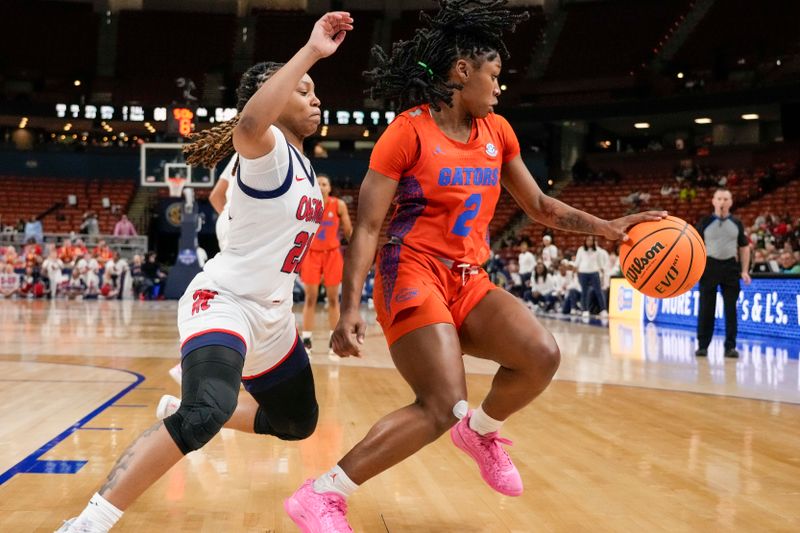 Mar 8, 2024; Greensville, SC, USA; Florida Gators guard Aliyah Matharu (2) on the dribble pressured by Ole Miss Rebels guard Zakiya Stephenson (21) during the second half at Bon Secours Wellness Arena. Mandatory Credit: Jim Dedmon-USA TODAY Sports