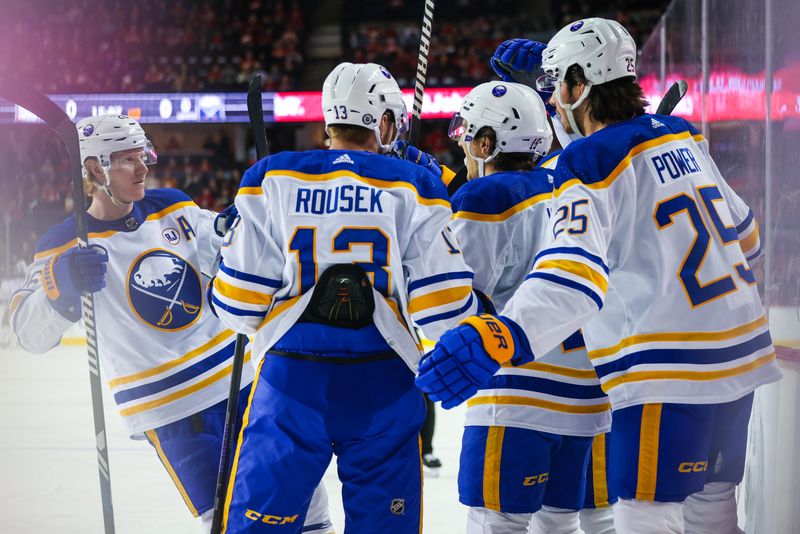 Mar 24, 2024; Calgary, Alberta, CAN; Buffalo Sabres center Peyton Krebs (19) celebrates his goal with teammates against the Calgary Flames during the first period at Scotiabank Saddledome. Mandatory Credit: Sergei Belski-USA TODAY Sports