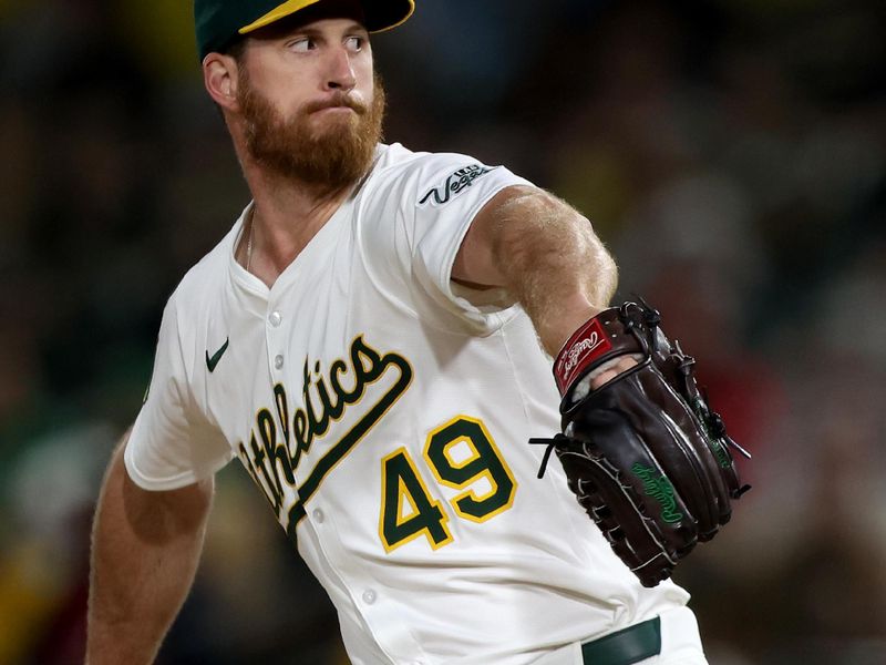 Jun 7, 2025; West Sacramento, California, USA; Athletics pitcher Michael Kelly (49) throws a pitch against the Baltimore Orioles during the ninth inning at Sutter Health Park. Mandatory Credit: Dennis Lee-Imagn Images