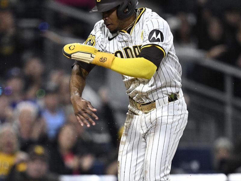 Apr 20, 2024; San Diego, California, USA; San Diego Padres left fielder Jose Azocar (28) celebrates after scoring a run against the Toronto Blue Jays during the eighth inning at Petco Park. Mandatory Credit: Orlando Ramirez-USA TODAY Sports