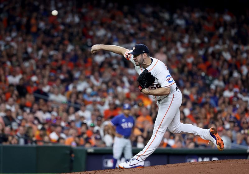 Oct 15, 2023; Houston, Texas, USA; Houston Astros pitcher Justin Verlander (35) throws during the third inning of game one of the ALCS against the Texas Rangers in the 2023 MLB playoffs at Minute Maid Park. Mandatory Credit: Troy Taormina-USA TODAY Sports
