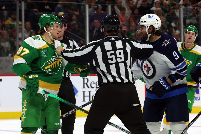 Apr 6, 2024; Saint Paul, Minnesota, USA; Winnipeg Jets left wing Alex Iafallo (9) is separated from Minnesota Wild left wing Kirill Kaprizov (97) during the second period at Xcel Energy Center. Mandatory Credit: Bruce Fedyck-USA TODAY Sports