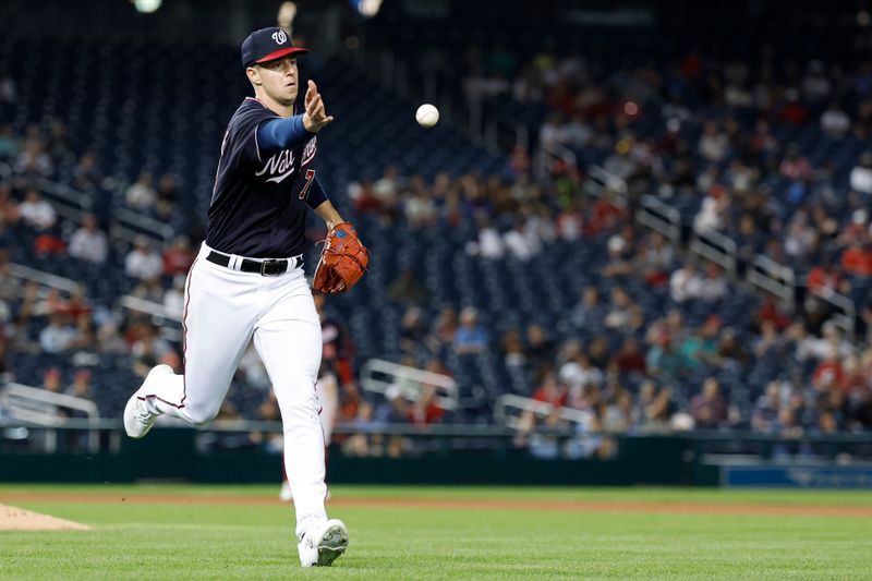 Sep 19, 2023; Washington, District of Columbia, USA; Washington Nationals starting pitcher Jackson Rutledge (79) tosses the ball to first base after fielding a ground ball hit by Chicago White Sox first baseman Andrew Vaughn (not pictured) during the seventh inning at Nationals Park. Mandatory Credit: Geoff Burke-USA TODAY Sports