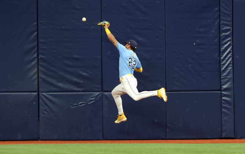 May 28, 2023; St. Petersburg, Florida, USA;Tampa Bay Rays center fielder Jose Siri (22) misses a fly ball in the third inning against the Los Angeles Dodgers at Tropicana Field. Mandatory Credit: Kim Klement-USA TODAY Sports