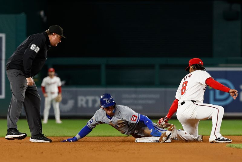 Sep 24, 2024; Washington, District of Columbia, USA; Kansas City Royals shortstop Bobby Witt Jr. (7) steals second base ahead of throw to Washington Nationals third base Jose Tena (8) during the tenth inning at Nationals Park. Mandatory Credit: Geoff Burke-Imagn Images