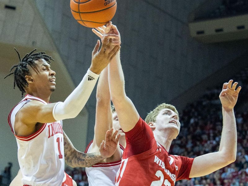 Jan 14, 2023; Bloomington, Indiana, USA; Indiana Hoosiers guard CJ Gunn (11) and Wisconsin Badgers forward Steven Crowl (22) fight for a rebound in the first half at Simon Skjodt Assembly Hall. Mandatory Credit: Trevor Ruszkowski-USA TODAY Sports