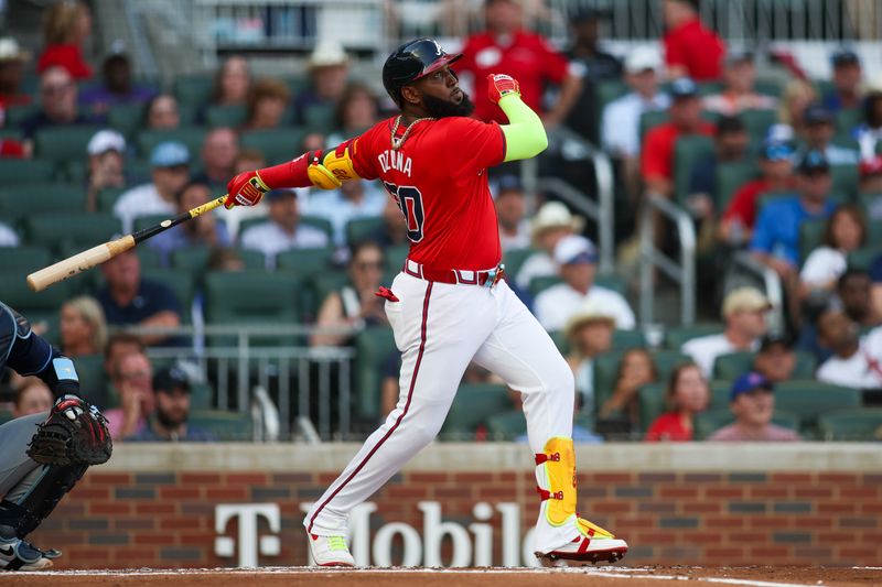 Jun 14, 2024; Atlanta, Georgia, USA; Atlanta Braves designated hitter Marcell Ozuna (20) hits a three-run home run against the Tampa Bay Rays in the first inning at Truist Park. Mandatory Credit: Brett Davis-USA TODAY Sports
