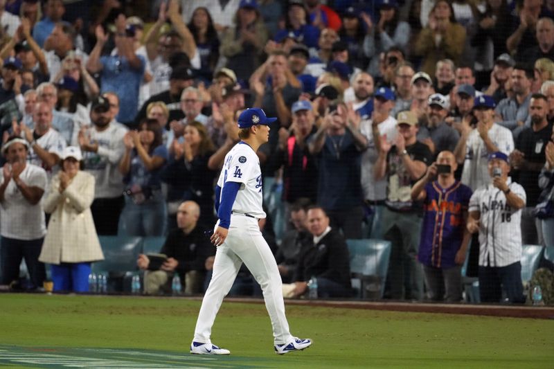 Oct 26, 2024; Los Angeles, California, USA; Los Angeles Dodgers pitcher Yoshinobu Yamamoto (18) is relieved in the seventh inning against the New York Yankees during game two of the 2024 MLB World Series at Dodger Stadium. Mandatory Credit: Kirby Lee-Imagn Images