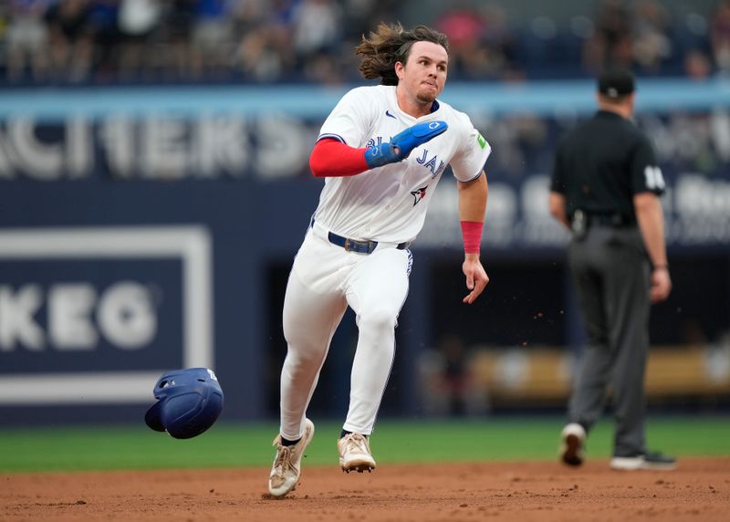 Jun 18, 2024; Toronto, Ontario, CAN; Toronto Blue Jays right fielder Addison Barger (47) heads to third base to score on a single by third baseman Ernie Clement (not pictured) against the Boston Red Sox during the second inning at Rogers Centre. Mandatory Credit: John E. Sokolowski-USA TODAY Sports