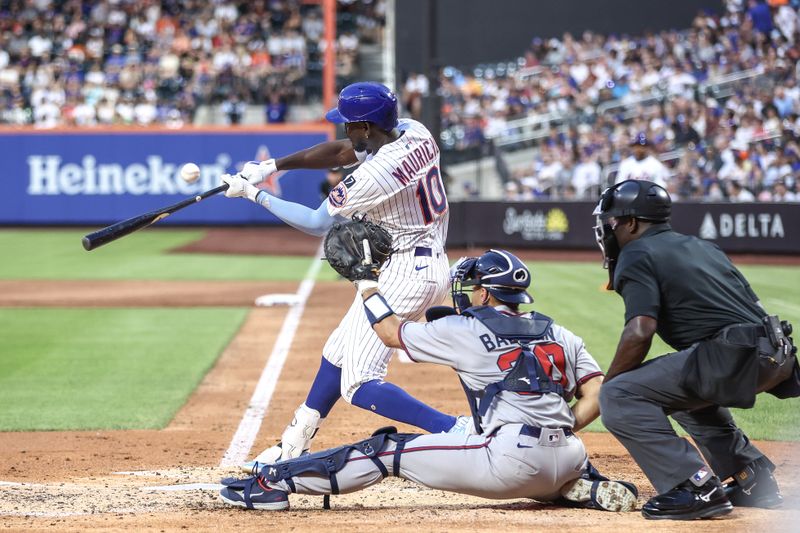 Jun 25, 2025; New York City, New York, USA;  New York Mets second baseman Ronny Mauricio (10) hits a solo home run in the third inning against the Atlanta Braves at Citi Field. Mandatory Credit: Wendell Cruz-Imagn Images