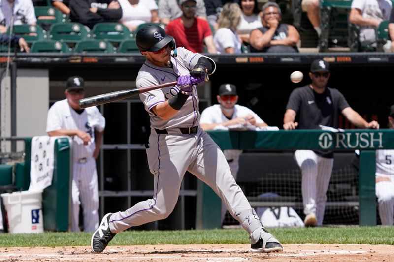 Jun 30, 2024; Chicago, Illinois, USA; Colorado Rockies first base Michael Toglia (4) hits a single against the Chicago White Sox during the third inning at Guaranteed Rate Field. Mandatory Credit: David Banks-USA TODAY Sports