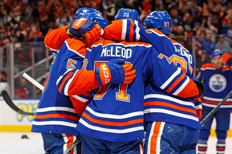 Jan 16, 2024; Edmonton, Alberta, CAN; The Edmonton Oilers celebrate a goal scored by forward Ryan McLeod (71) during the third period against the Toronto Maple Leafs at Rogers Place. Mandatory Credit: Perry Nelson-USA TODAY Sports