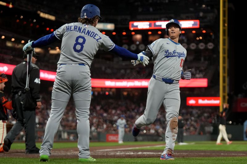 Sep 13, 2025; San Francisco, California, USA; Los Angeles Dodgers designated hitter Shohei Ohtani (17) is congratulated by third baseman Enrique Hernandez (8) after scoring a run against the San Francisco Giants in the ninth nning at Oracle Park. Mandatory Credit: Cary Edmondson-Imagn Images