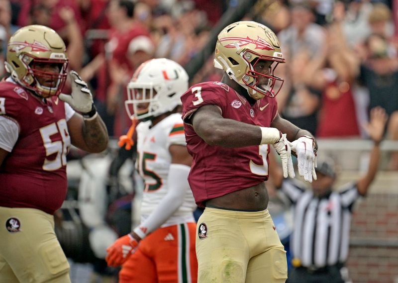 Nov 11, 2023; Tallahassee, Florida, USA; Florida State Seminoles running back Trey Benson (3) celebrates a touchdown against the Miami Hurricanes during the first half at Doak S. Campbell Stadium. Mandatory Credit: Melina Myers-USA TODAY Sports